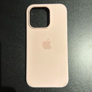 Apple silicone case in Chalk Pink for iPhone 14 Pro.
